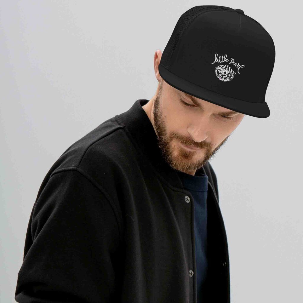 Man wearing black mesh trucker hat