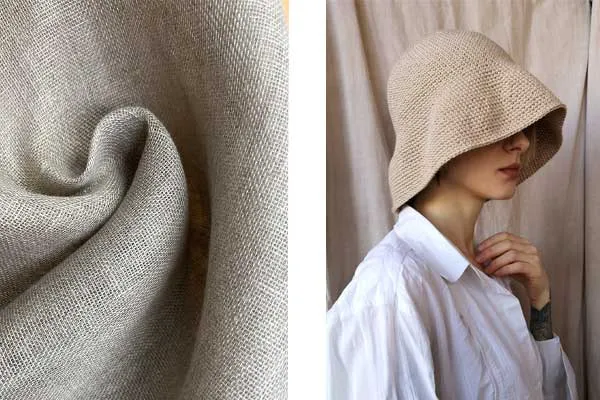 Close-up of beige linen fabric and person wearing beige linen bucket hat.