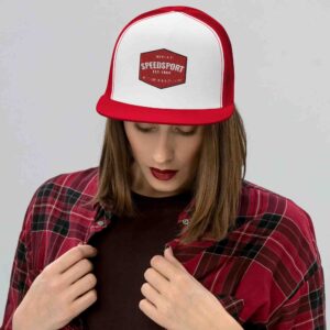 Woman wearing red and white trucker hat