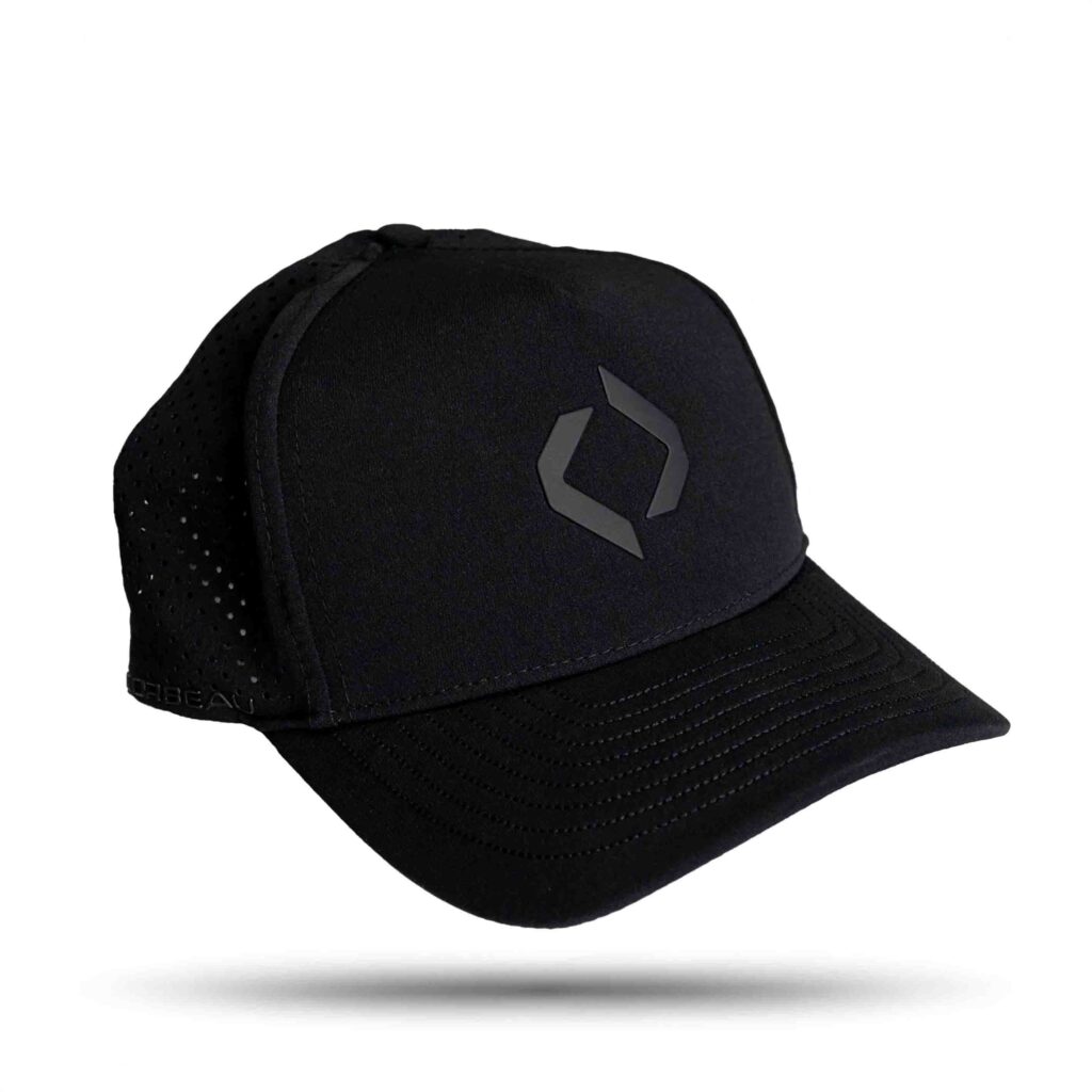 Black trucker cap with perforated mesh back and minimalist logo on front