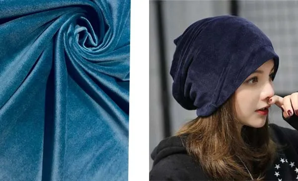 Close-up of blue velvet fabric and woman wearing navy blue velvet beanie.