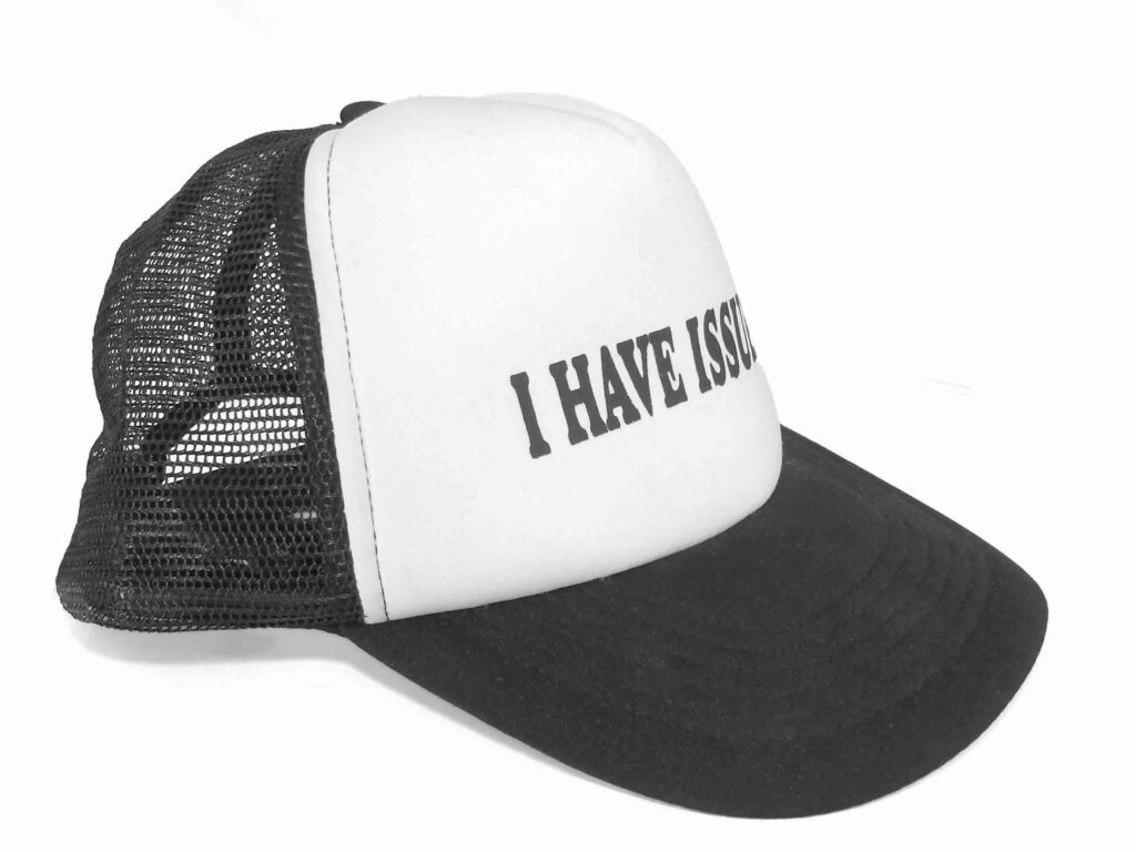 Black and white mesh cap with "I HAVE ISSUES" text on front panel.