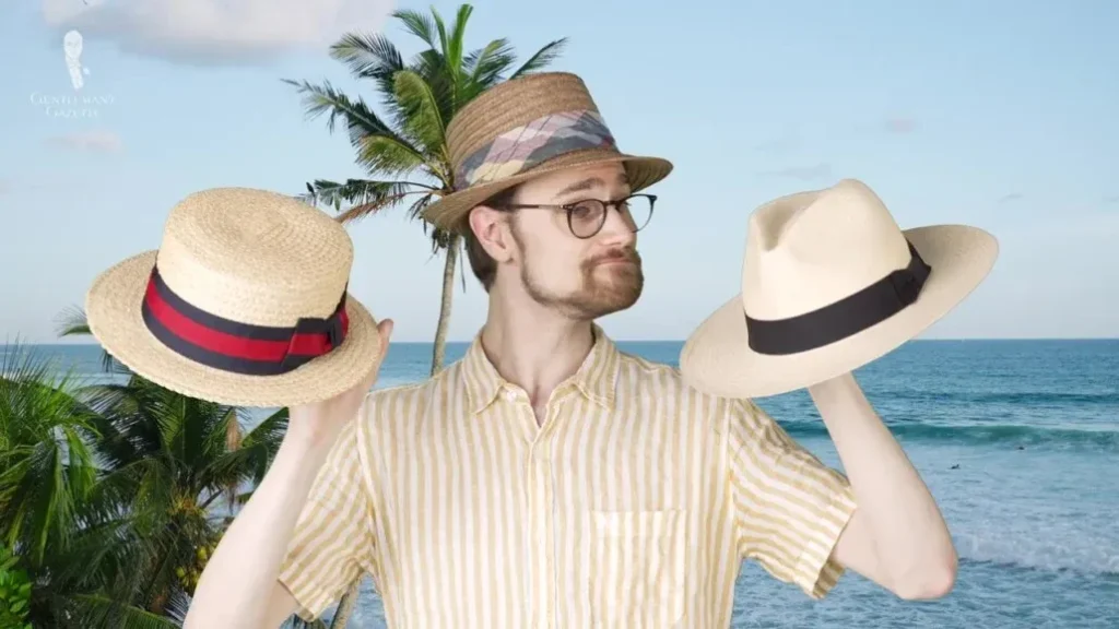 Man wearing hat, holding two different straw hats by the sea.