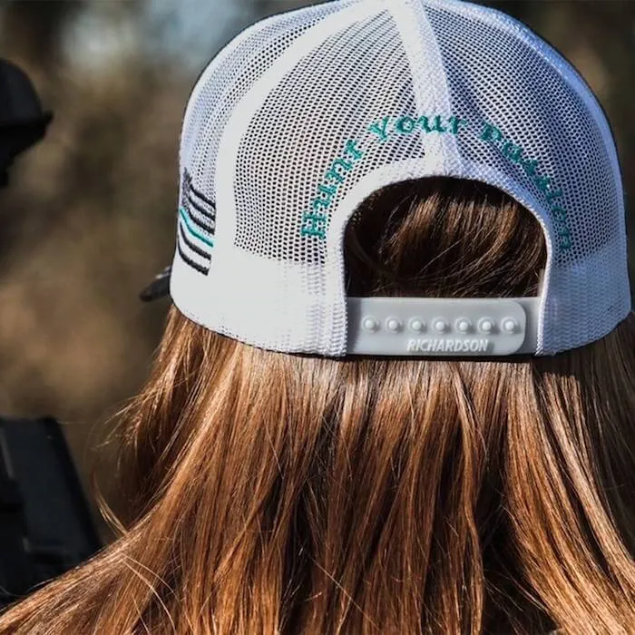 White mesh snapback hat with back embroidery and adjustable plastic closure.