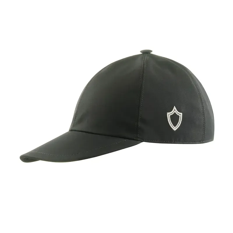 Black nylon baseball cap with white shield logo on side, isolated on white.