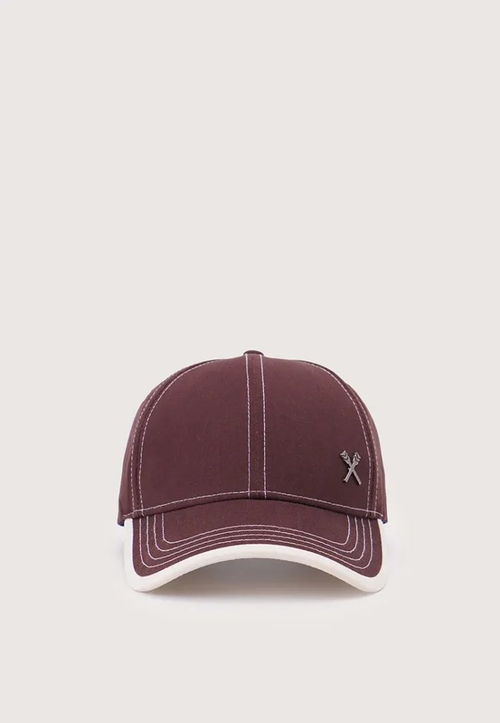 Front view of brown baseball cap with white stitching and logo on light background.