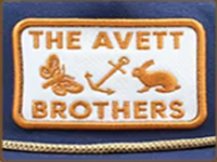 Rectangular patch with "The Avett Brothers" text, anchor, bee, and rabbit embroidered in gold and white.