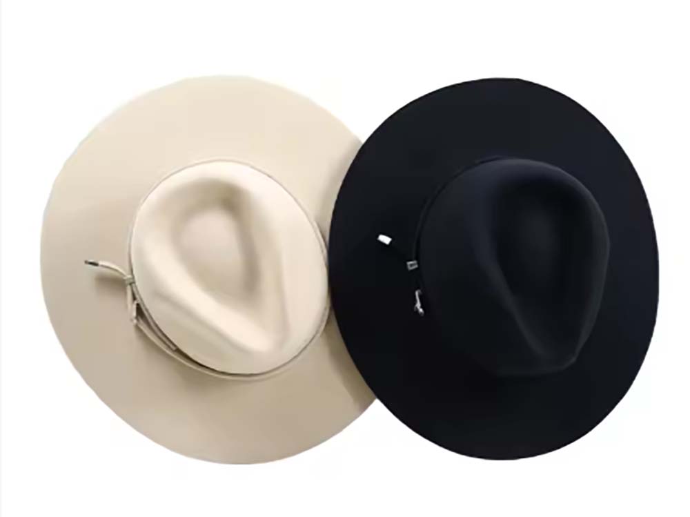 Beige and black cowboy hats placed side by side on white background.