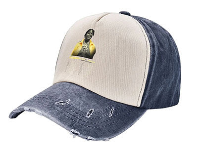 Beige and navy two-tone baseball cap with distressed brim and printed graphic on front.