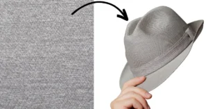 Gray fabric transforming into a stylish gray fedora hat being held.