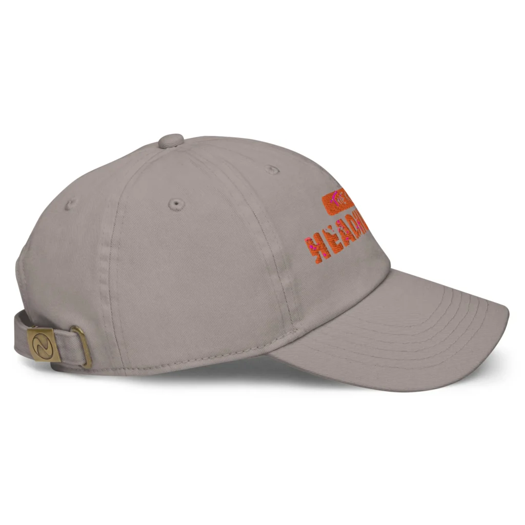 Side view of grey fitted baseball cap with orange embroidery and adjustable strap.