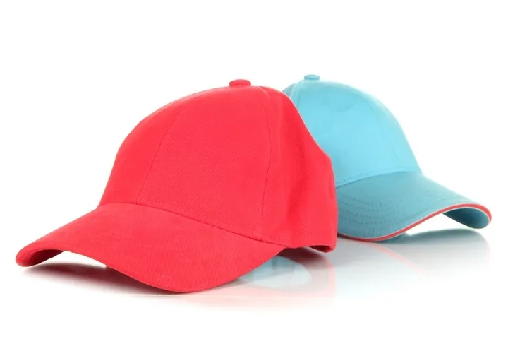 Two baseball caps in red and blue on white background
