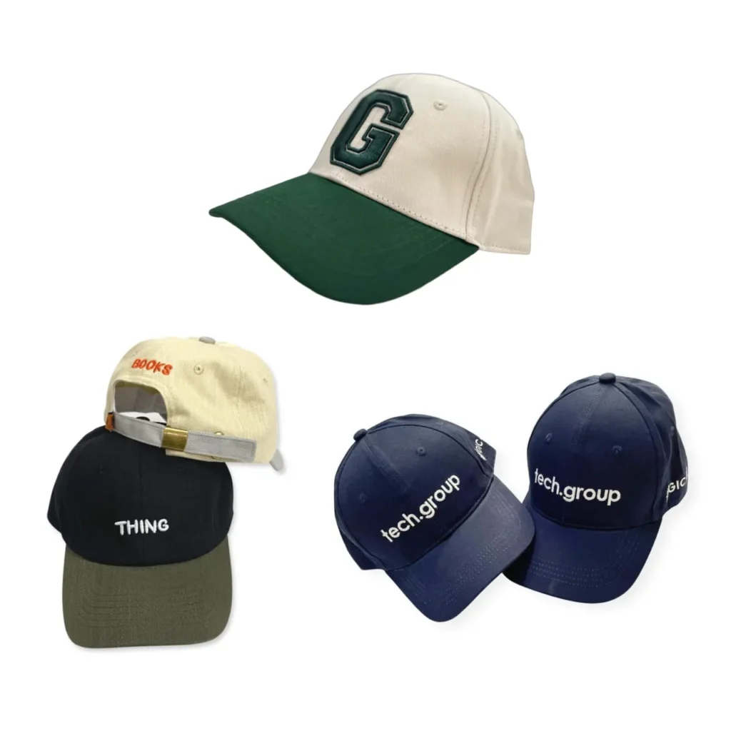 Different hats with embroidered text and logos, including a green-brimmed cap and several navy caps with branding.