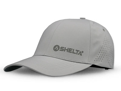 Gray baseball cap with "Sheltá" logo printed on front and ventilation holes on side.