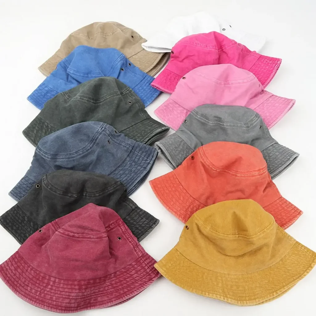 Assorted colorful bucket hats in various shades on white background.