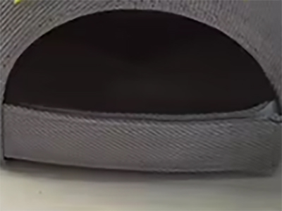 Rear view of gray baseball cap showing opening and fabric texture.