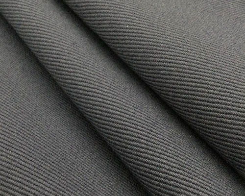 Close-up of dark grey twill fabric with diagonal weave texture.