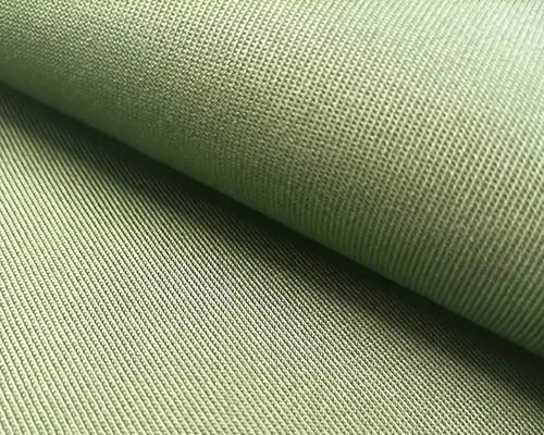 Close-up of olive green canvas fabric with woven texture.