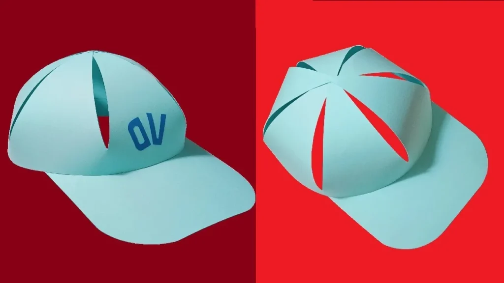 Light blue paper cap with geometric cutouts shown from front and back on red background