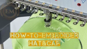 Close-up of embroidery machine stitching a green cap with golden text overlay "HOW-TO-EMBROIDER HAT & CAP".