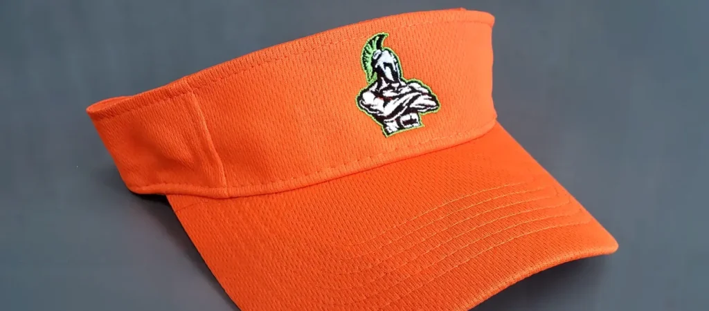 Orange visor hat with embroidered green and white mascot logo