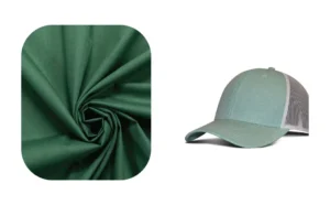 Green poly cotton fabric sample next to matching trucker cap design